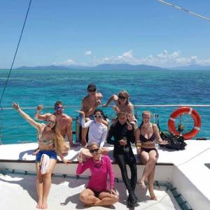 a group of people in a boat on a body of water