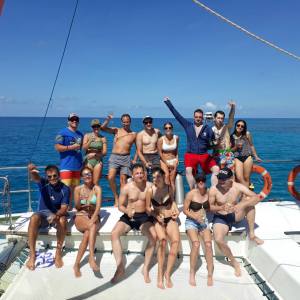 a group of people on a boat in the water