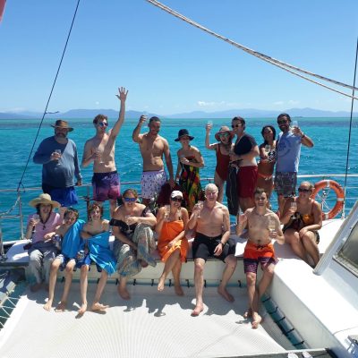 a group of people riding on the back of a boat