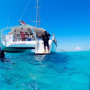 a group of people on a boat in the water