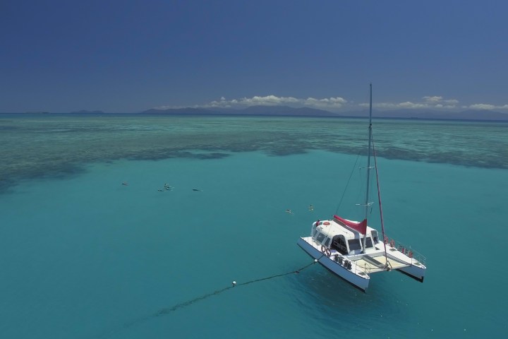 a small boat in a large body of water