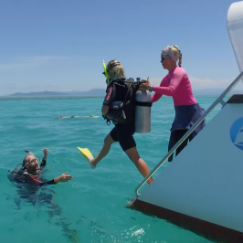 a group of people on a boat in the water