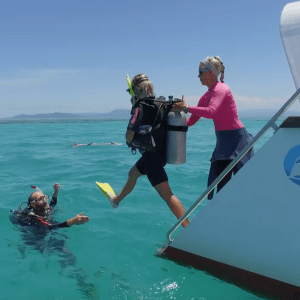a group of people on a boat in the water