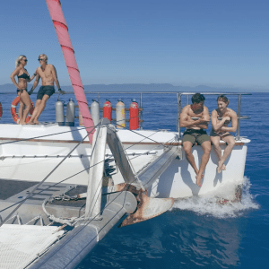 a group of people on a boat in the water