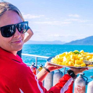a woman wearing sunglasses posing for the camera