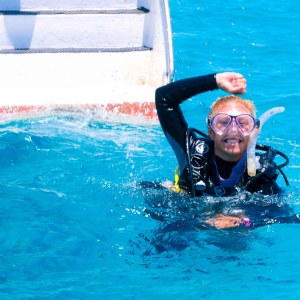 a man swimming in a body of water
