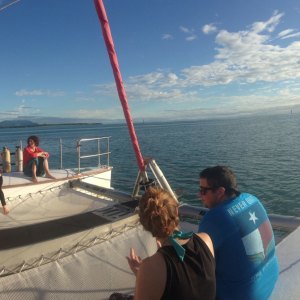 a group of people in a boat on a body of water